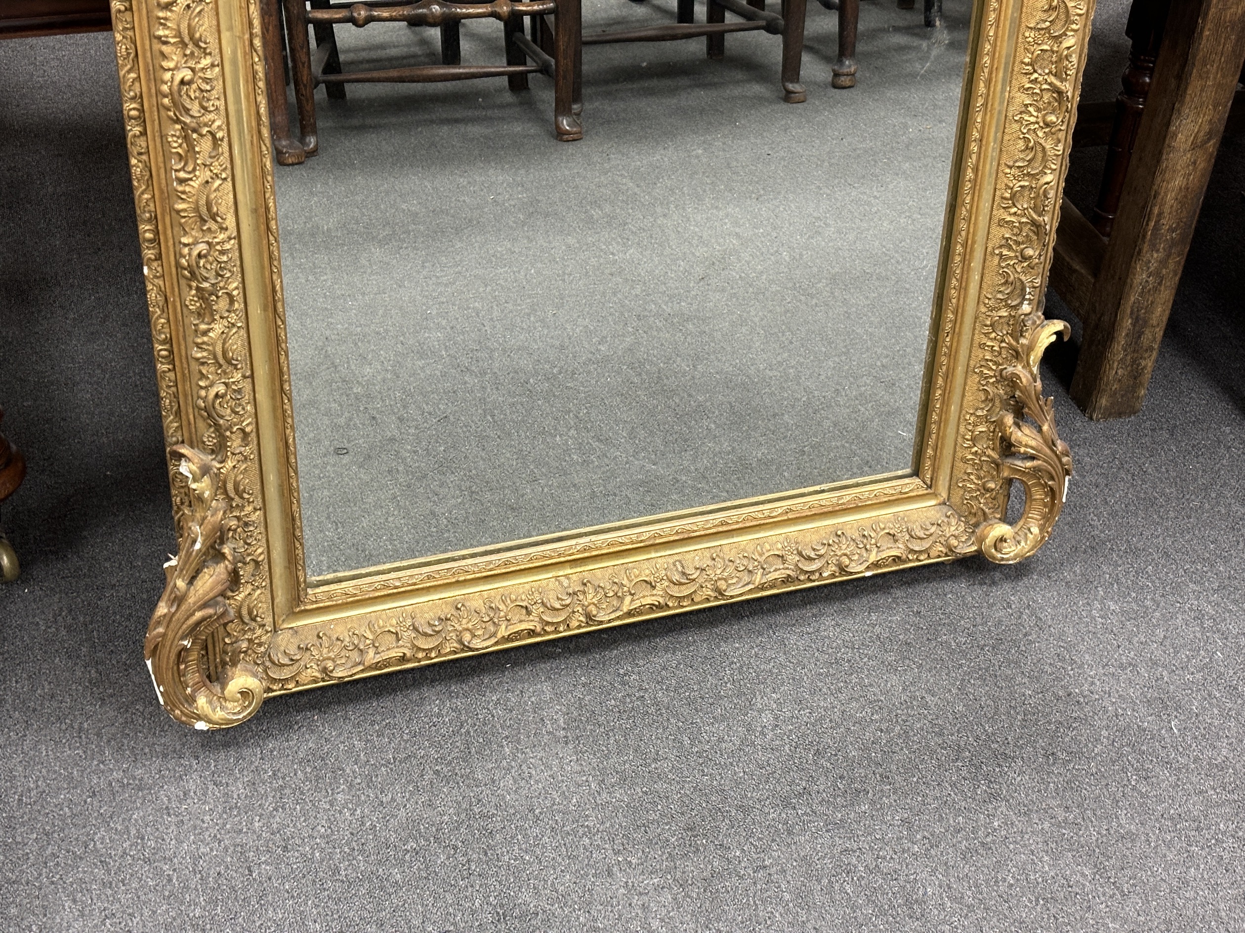 A 19th century French giltwood and composition overmantel mirror with pierced scroll pediment, width 86cm, height 158cm